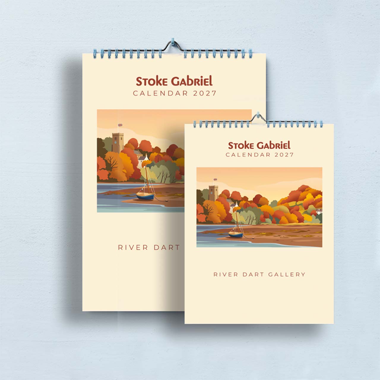 Stoke Gabriel Calendar 2027 shown in both sizes, A3 behind and A4 in front, hanging side by side
